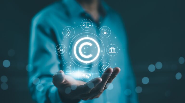 man hold digital icons representing copyright