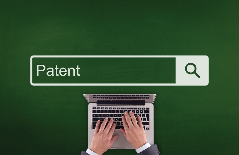 man searches in the search box for "patent"