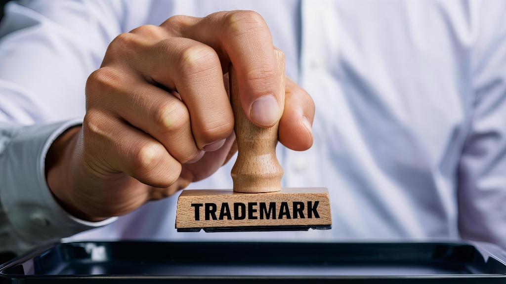 Hand Holding Trademark Rubber Stamp