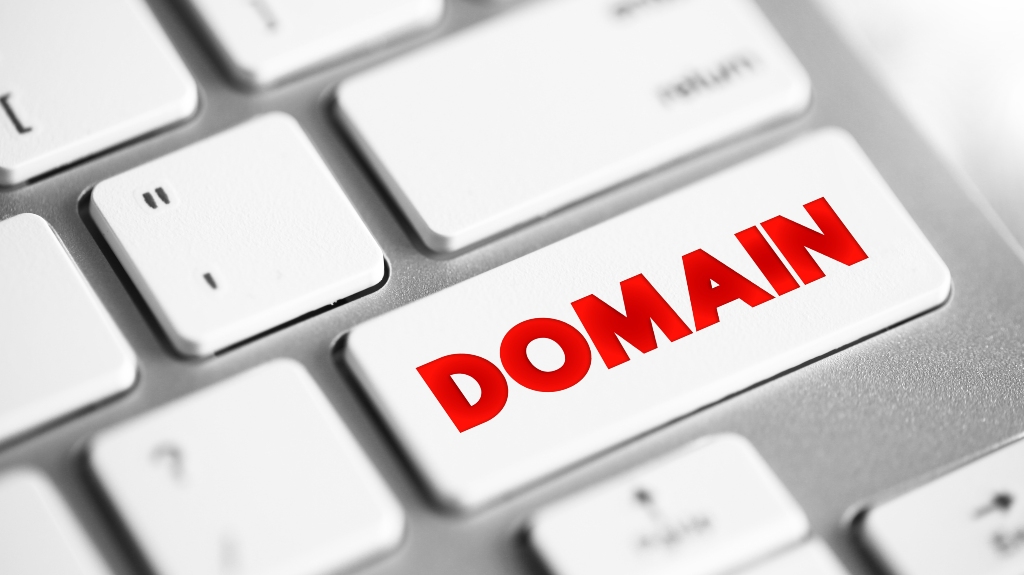 word _domain_ on laptop keyboard