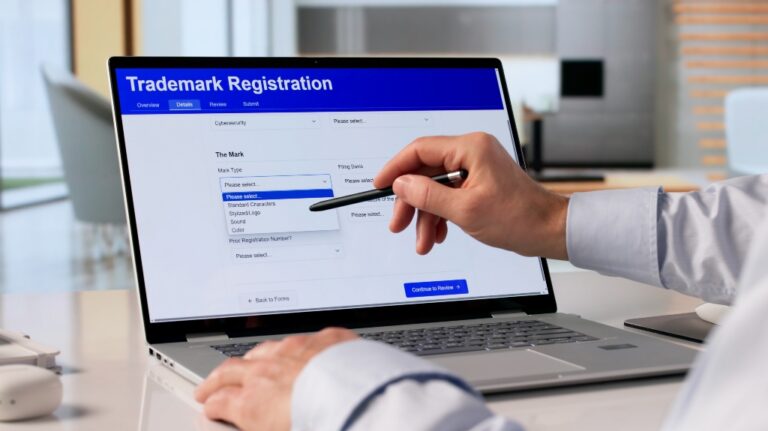 Man Using Laptop To Submit Trademark Application